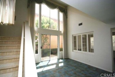 Light and bright formal living room with high ceil