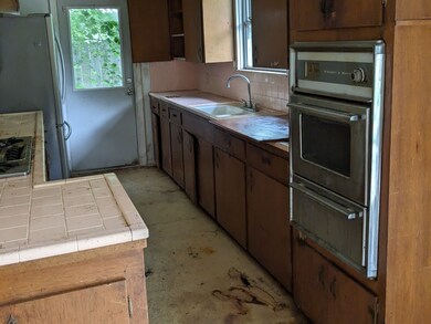 Kitchen overlooks the back of the house