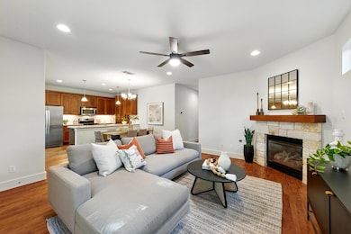 Living room featuring light wood-style floors, a 