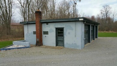 view of 4 1/2 car concrete block garage looking no