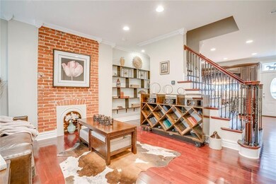 Gorgeous floors, exposed brick and custom cabinetr