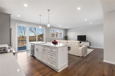 View of open floorplan between kitchen and living