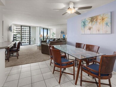 Carpeted dining space featuring floor to ceiling w