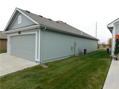 525 Neptune Dr, Raymore, MO 64083 - photo 2