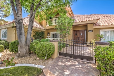 Mediterranean / spanish-style home featuring a gat