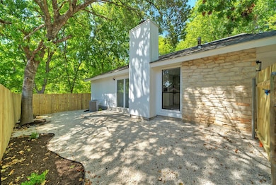 Fenced backyard with a patio area