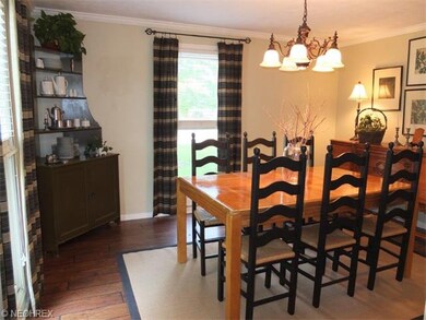Large dining room with crown molding and new lamin