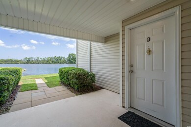 Entrance to property with a water view