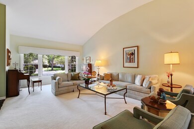 Large Living Room with Barreled Ceiling over looks