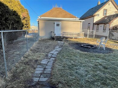 Backyard, fire pit and rear of house