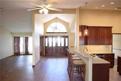 View from family room and kitchen to living room a