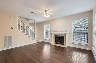 Unfurnished living room featuring a ceiling fan, 