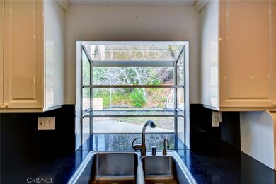 Garden window overlooks back yard