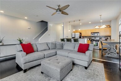 Living room featuring hardwood flooring, a baseboa