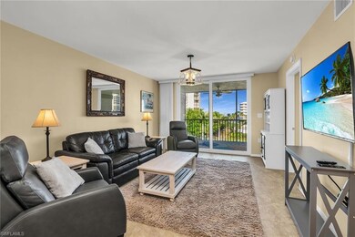 Living area with a chandelier and light tile patterned flooring