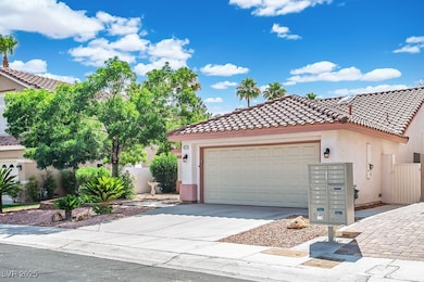 Mediterranean / spanish house featuring stucco siding, a tiled roof, concrete driveway, and an attached garage
