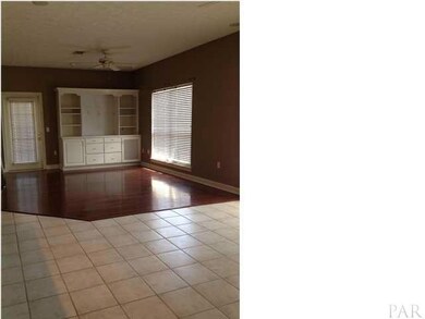 Den adjoins the kitchen, also with built-ins