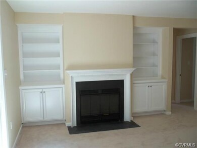 Living room has new custom built-ins and fireplace