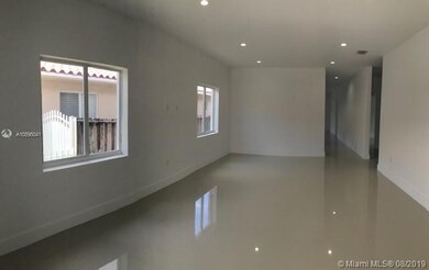 VIEW OF LIVING/DINING ROOM FROM FRONT DOOR
