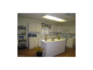 Open and bright kitchen with center island, plenty