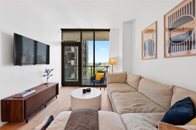 Living room with light wood-style flooring and fl