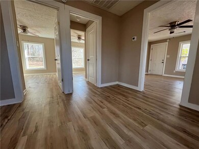 Spare room featuring visible vents, a textured cei