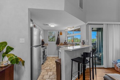 Kitchen with stainless steel appliances, a sink, 