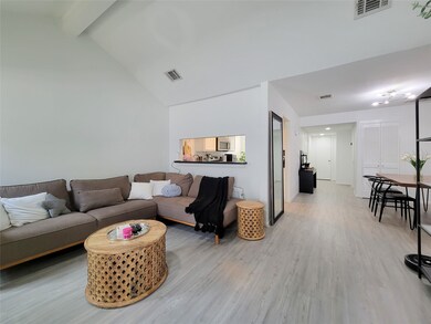 Reverse view of living room with pass through to k