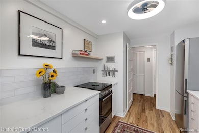 1300 E. Lafayette #2407 — Elevated City Living with Iconic Views.  Perched high on the 24th floor of Detroit’s iconic 1300 East Lafayette Cooperative, this 1,664 sqft corner residence embodies the best of modern city living. Recently reimagined with 