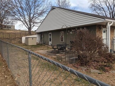 Fenced in patio area for pets and flowers