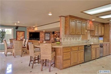 Kitchen view toward informal eating area