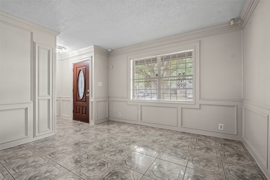 This room features elegant wainscoting and large t