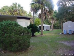 2 sheds on side