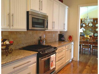 Photo. Kitchen looking into the vaulted ceiling Di