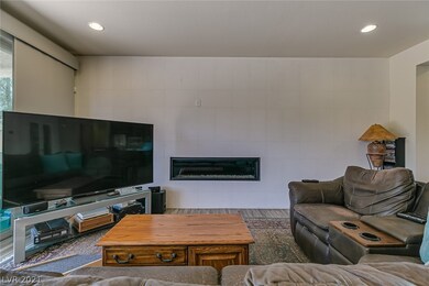 Upgraded Tiled Wall And Linear Fireplace.