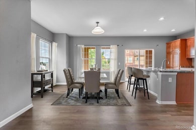 Digitally staged dining room/kitchen