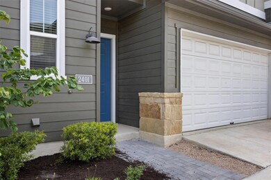 Property entrance featuring an attached garage