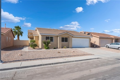 Ranch-style home with stucco siding, an attached g