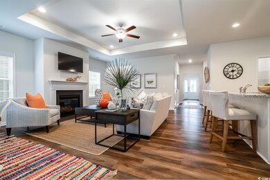 Living area featuring dark wood finished floors, p
