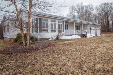 Large open front porch. Metal roof.