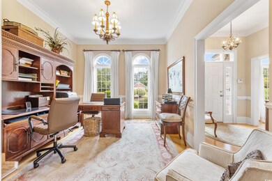 Home office featuring a notable chandelier and orn
