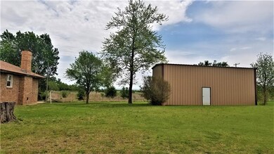 15x40x14 shop with overhead door on west side.