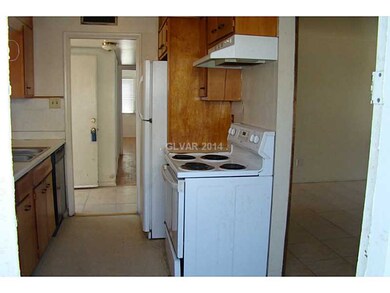 Kitchen. Electric stove and range hood.