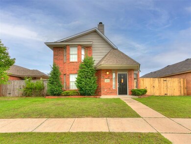 Traditional-style home with a front lawn, fence, a