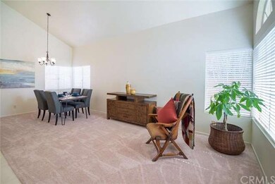 Living room and dining room with vaulted ceilings 