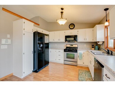 Kitchen shines!  Freshly painted cabinetry also fe