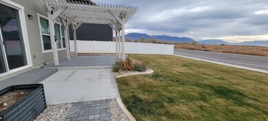 View of yard with a deck with mountain view and a pergola