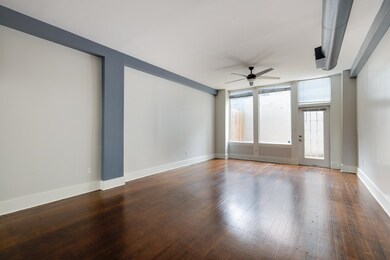 Spare room featuring ceiling fan, hardwood / wood-style flooring, and baseboards