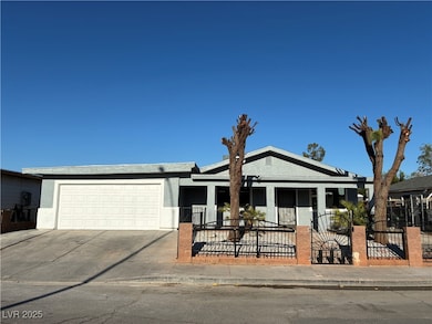 View of front facade featuring stucco siding, driv