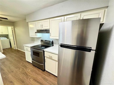 Kitchen with new LED light, Nice Porcelain countertops, Modern Cabinet Doors, SS Range Hood, Stainless Steel Refrigerator!